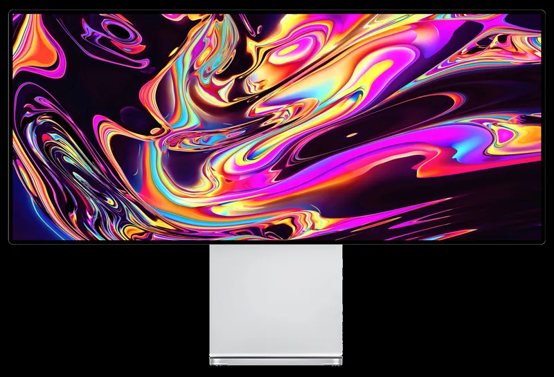 Monitor Kuycon W34KB vor schwarzem Hintergrund mit sehr gesättigten Schlieren in Rosa, Orange, Gelb und Blau, zur Veranschaulichung der Farbvielfalt